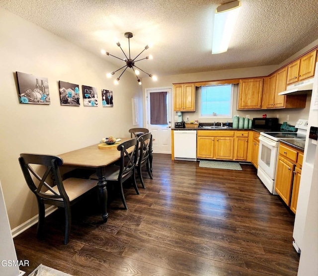 2904 Boyds Creek Hwy Unit 4, Sevierville, TN 37876 - kitchen with white appliances, under cabinet range hood, dark countertops, a textured ceiling, and dark wood-style flooring