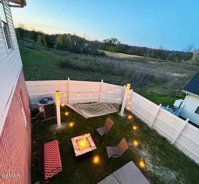 2904 Boyds Creek Hwy Unit 4, Sevierville, TN 37876 - fenced backyard with an outdoor fire pit
