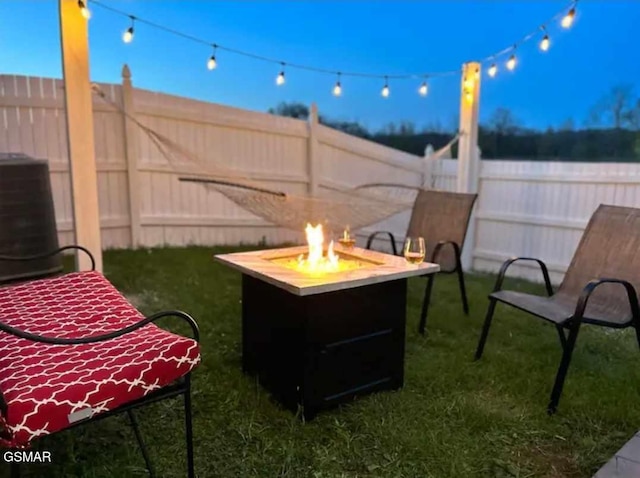 2904 Boyds Creek Hwy Unit 4, Sevierville, TN 37876 - fenced backyard featuring a fire pit