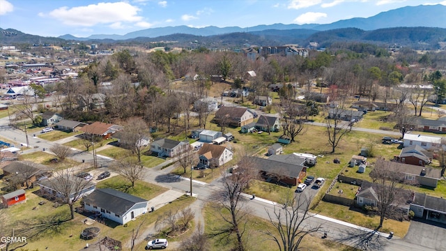 drone / aerial view featuring a residential view and a mountain view