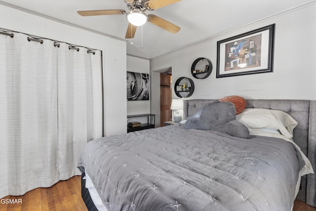 bedroom with ceiling fan and wood finished floors