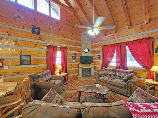 living room featuring a wealth of natural light, wooden ceiling, beamed ceiling, and wood-type flooring