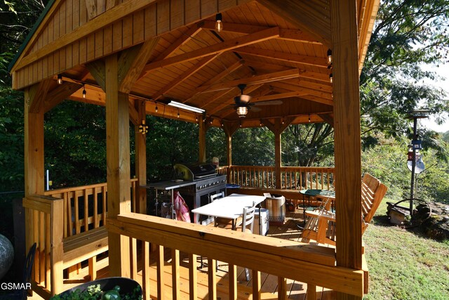 wooden terrace with a gazebo, a grill, and ceiling fan