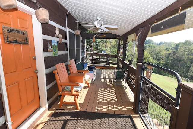 deck featuring ceiling fan and a porch