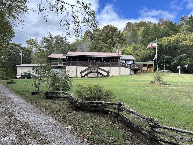 exterior space with a lawn and a wooden deck