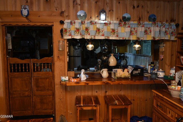 bar featuring wood walls