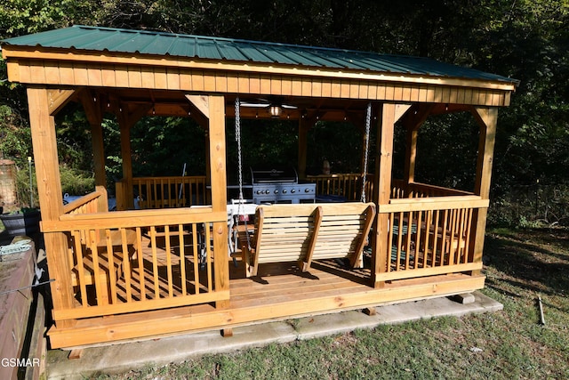 deck with a gazebo, a grill, and ceiling fan