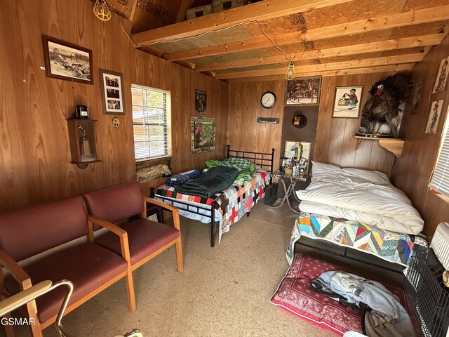 bedroom featuring wooden walls and beamed ceiling