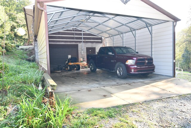 view of car parking with a garage and a carport