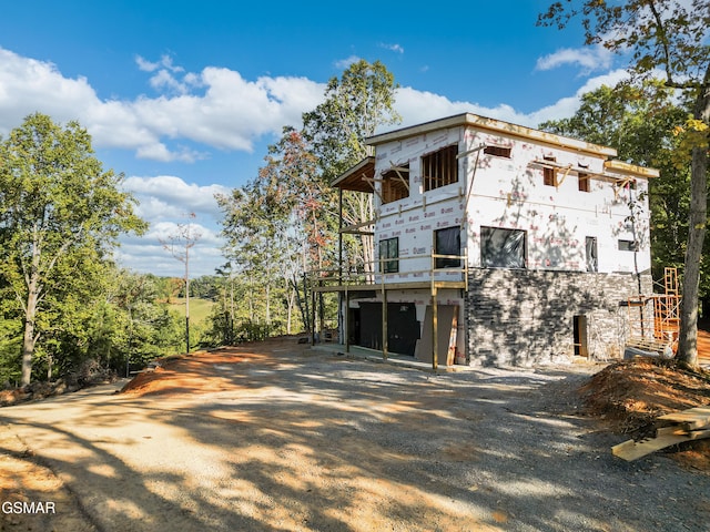 exterior space featuring a garage and a deck