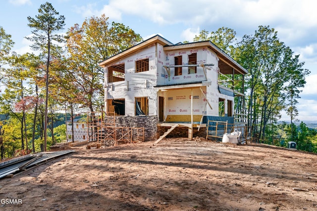 back of property with a balcony