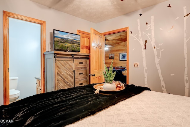 1001 Sunrise Blvd, Sevierville, TN 37862 - bedroom featuring wooden walls and a textured ceiling