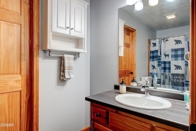 1001 Sunrise Blvd, Sevierville, TN 37862 - full bathroom with a shower with shower curtain, vanity, and toilet