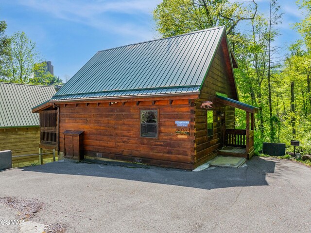 817 Eagle Cove Way, Gatlinburg, TN 37738 - view of side of property with a metal roof, a chimney, and crawl space