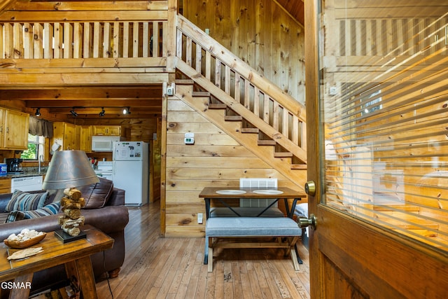 817 Eagle Cove Way, Gatlinburg, TN 37738 - living area featuring wooden walls, light wood-style floors, and stairway
