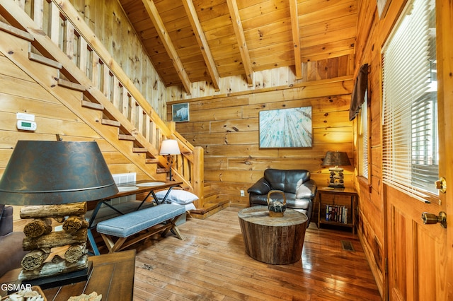 817 Eagle Cove Way, Gatlinburg, TN 37738 - living area featuring wooden walls, wood-type flooring, wooden ceiling, and stairway