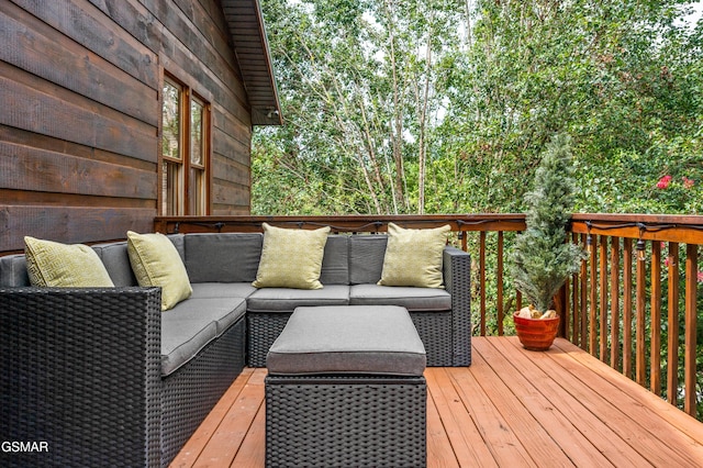 wooden deck with an outdoor hangout area