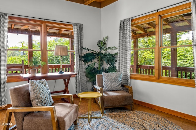 sitting room with hardwood / wood-style flooring