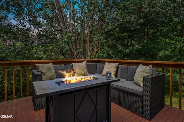 deck with an outdoor fire pit