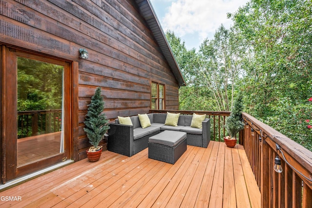 wooden deck with outdoor lounge area