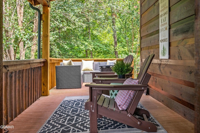 deck with an outdoor hangout area