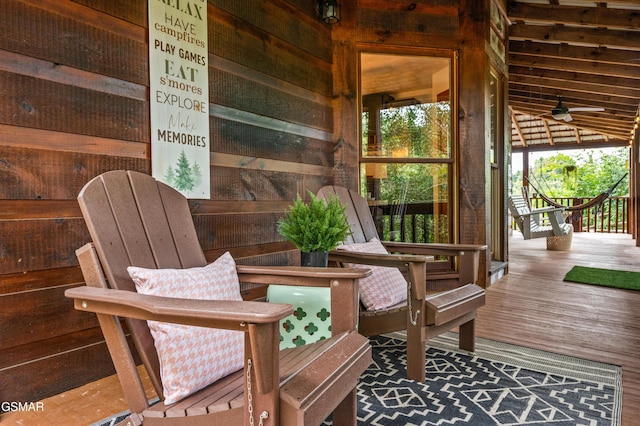 deck featuring ceiling fan and a porch