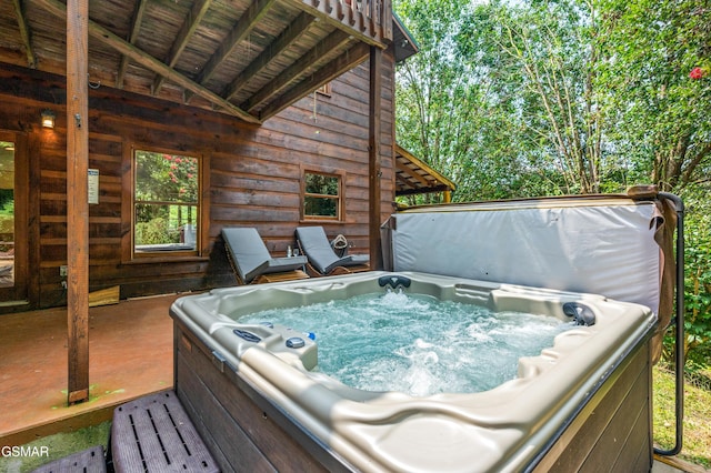 deck featuring a hot tub