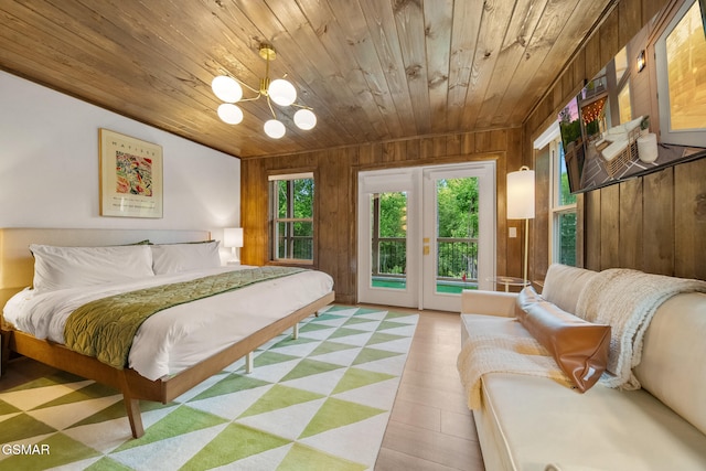 1924 Pine Ct, Sevierville, TN 37876 - bedroom with access to outside, wooden walls, wood ceiling, and a chandelier