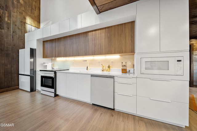 1924 Pine Ct, Sevierville, TN 37876 - kitchen featuring white appliances, modern cabinets, light countertops, and white cabinetry