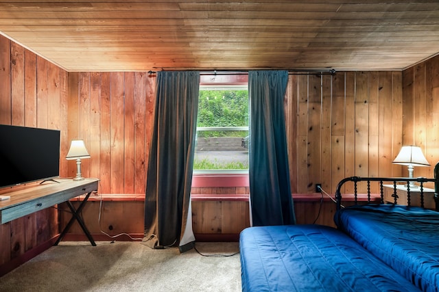 bedroom featuring carpet flooring, wood walls, and wooden ceiling