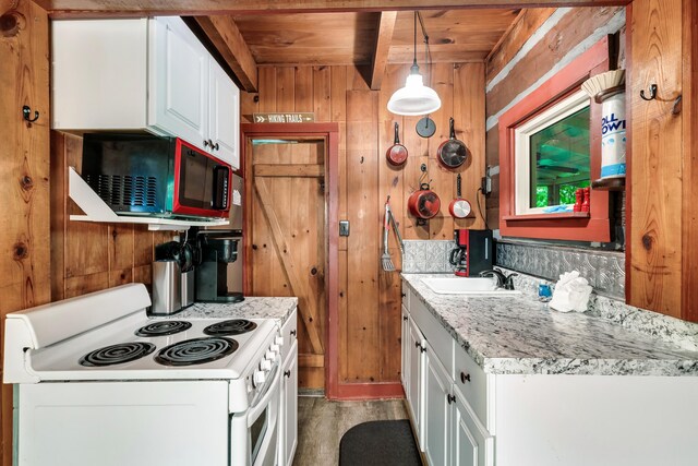 kitchen featuring wood ceiling, wooden walls, electric range, decorative light fixtures, and white cabinetry