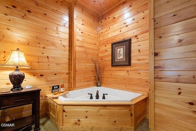 bathroom featuring wood ceiling, a tub to relax in, and wooden walls