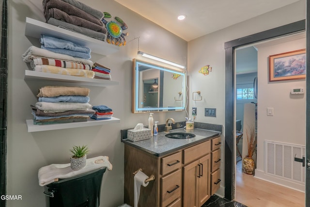 1920 Inskip Ln, Dandridge, TN 37725 - bathroom featuring vanity, recessed lighting, baseboards, and wood finished floors
