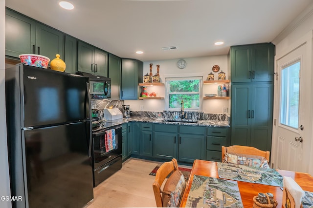 1920 Inskip Ln, Dandridge, TN 37725 - kitchen with black appliances, open shelves, green cabinets, a sink, and light wood finished floors