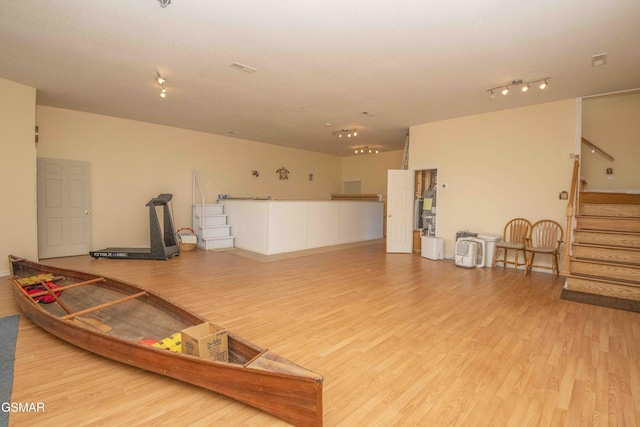 interior space featuring stairs and wood finished floors