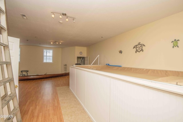 hallway featuring light wood-style flooring