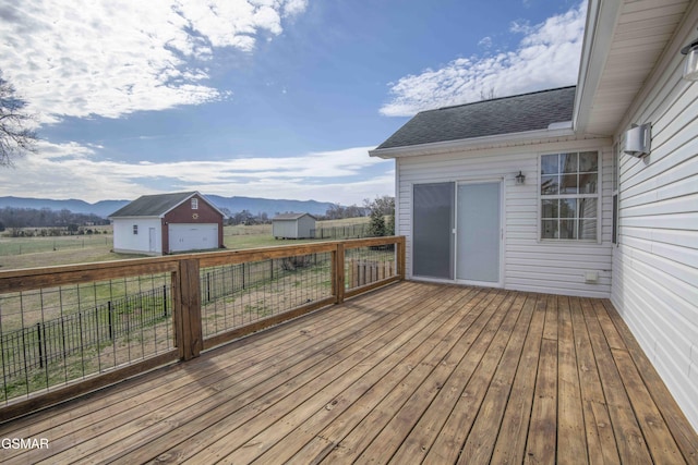 wooden terrace with a mountain view and an outbuilding