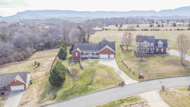 drone / aerial view featuring a rural view and a mountain view