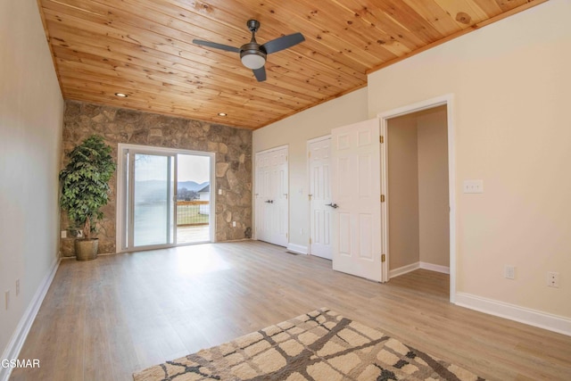 spare room with wooden ceiling, baseboards, and light wood finished floors