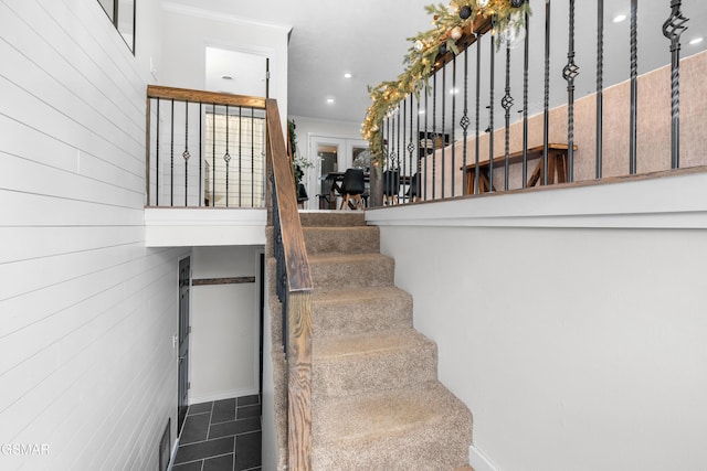 stairway with tile patterned flooring and french doors