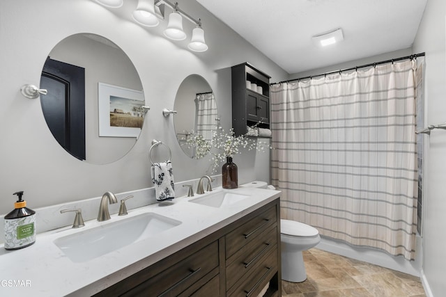 full bathroom featuring shower / bath combo, toilet, and vanity