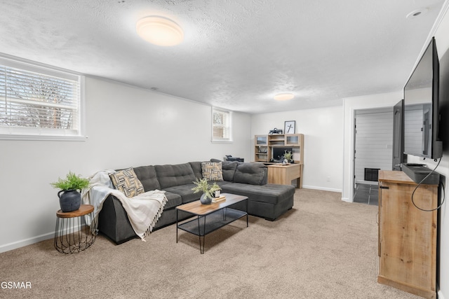 living room featuring a textured ceiling and light carpet