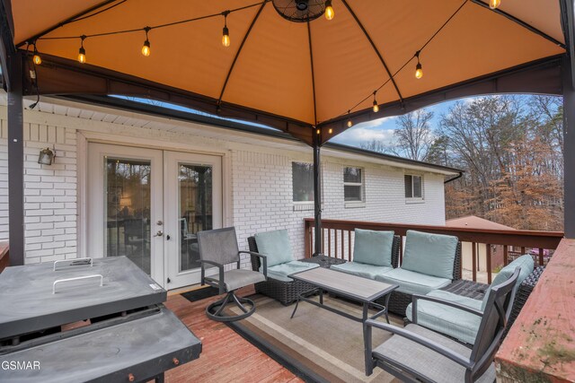 deck with a gazebo and an outdoor hangout area