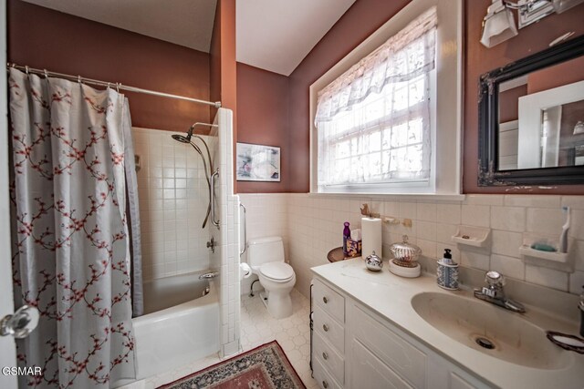 294 Clifton Heights Rd, Newport, TN 37821 - bathroom featuring vanity, wainscoting, toilet, tile walls, and shower / bathtub combination with curtain