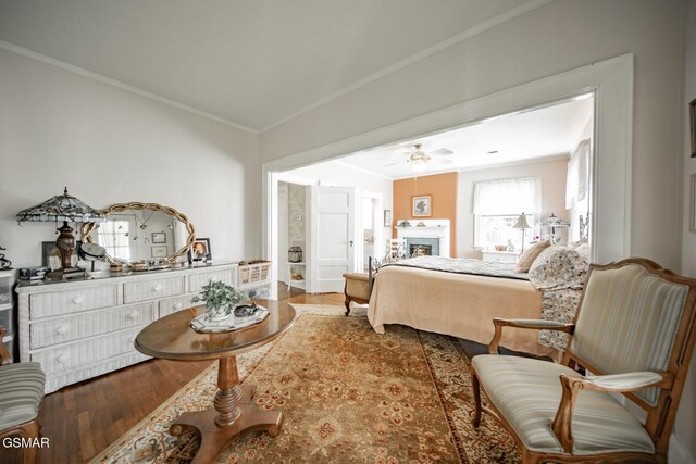 294 Clifton Heights Rd, Newport, TN 37821 - bedroom featuring ornamental molding, a fireplace, and wood finished floors