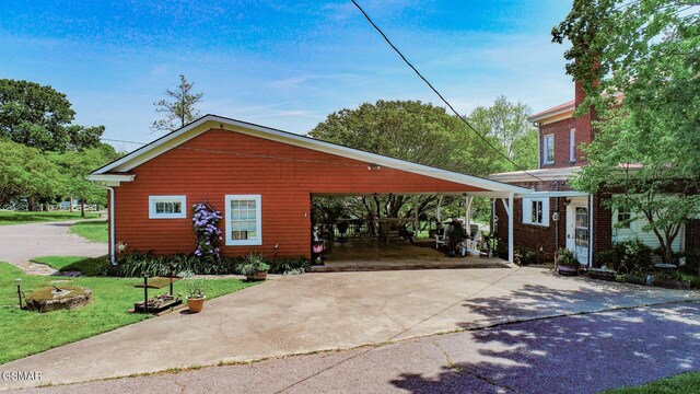 294 Clifton Heights Rd, Newport, TN 37821 - view of front of home with concrete driveway, a front yard, and a carport