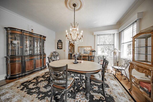 294 Clifton Heights Rd, Newport, TN 37821 - dining area with crown molding, light wood-type flooring, and a notable chandelier