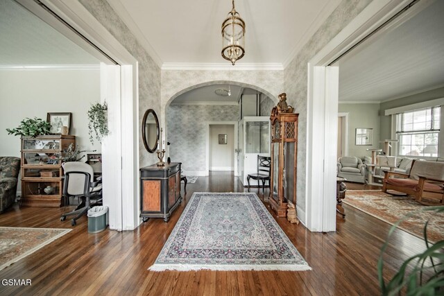 294 Clifton Heights Rd, Newport, TN 37821 - entryway featuring wallpapered walls, arched walkways, dark wood-style floors, and ornamental molding