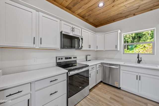 284 Laurel Oaks Way, Gatlinburg, TN 37738 - kitchen featuring stainless steel appliances, wooden ceiling, light countertops, light wood-style floors, and white cabinetry