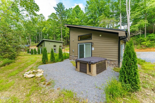 5145 E Parkway Pkwy, Cosby, TN 37722 - back of house with an outbuilding and stone siding